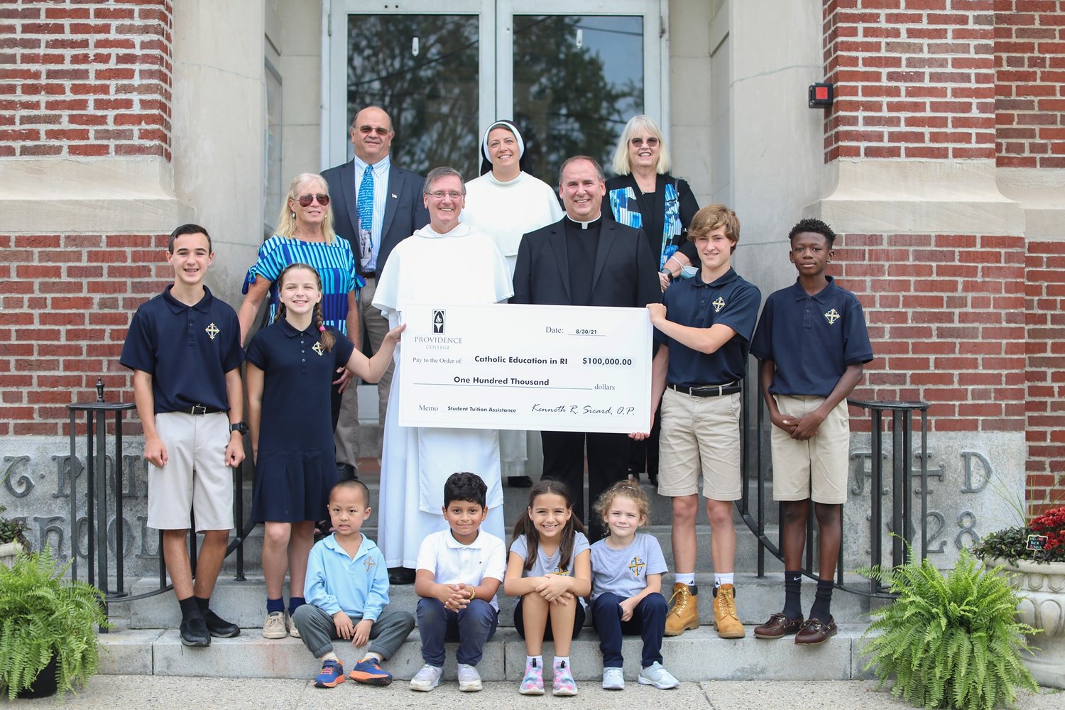 On Wednesday, Sept. 15, at St. Pius V School, Providence College presented a second gift of $100,000 to the Diocese of Providence’s Catholic School Office to support Catholic education in Rhode Island through its FriarServe program. Principals from St. Rocco School, Blessed Sacrament School, St. Pius V School and St. Augustine School were in attendance.